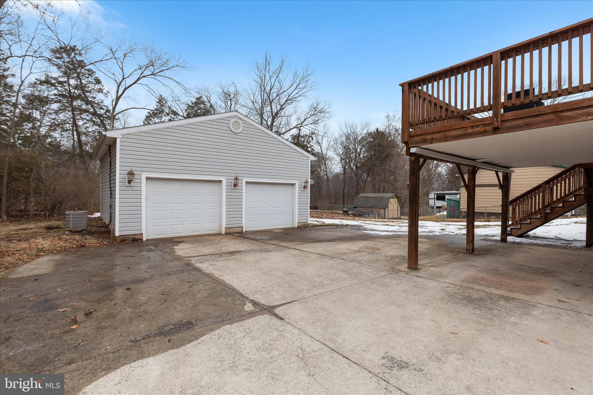 7398 Roxbury Avenue Manassas, VA 20109 - Photo 45 of 75 a view of a house with a wooden deck