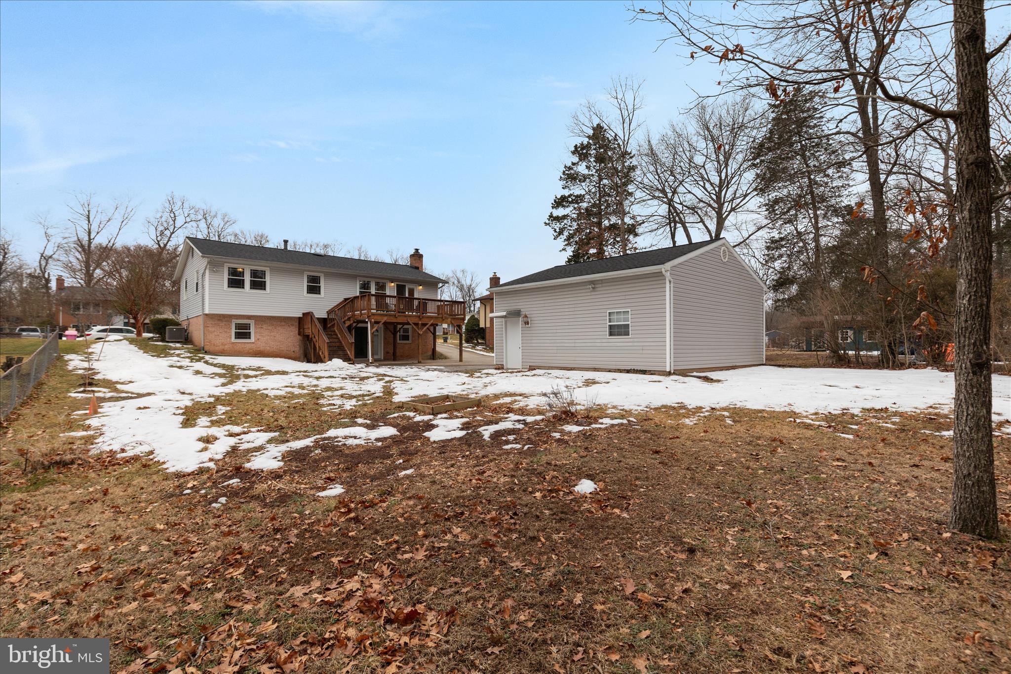 7398 Roxbury Avenue Manassas, VA 20109 - Photo 48 of 75 a front view of a house with a yard covered in snow