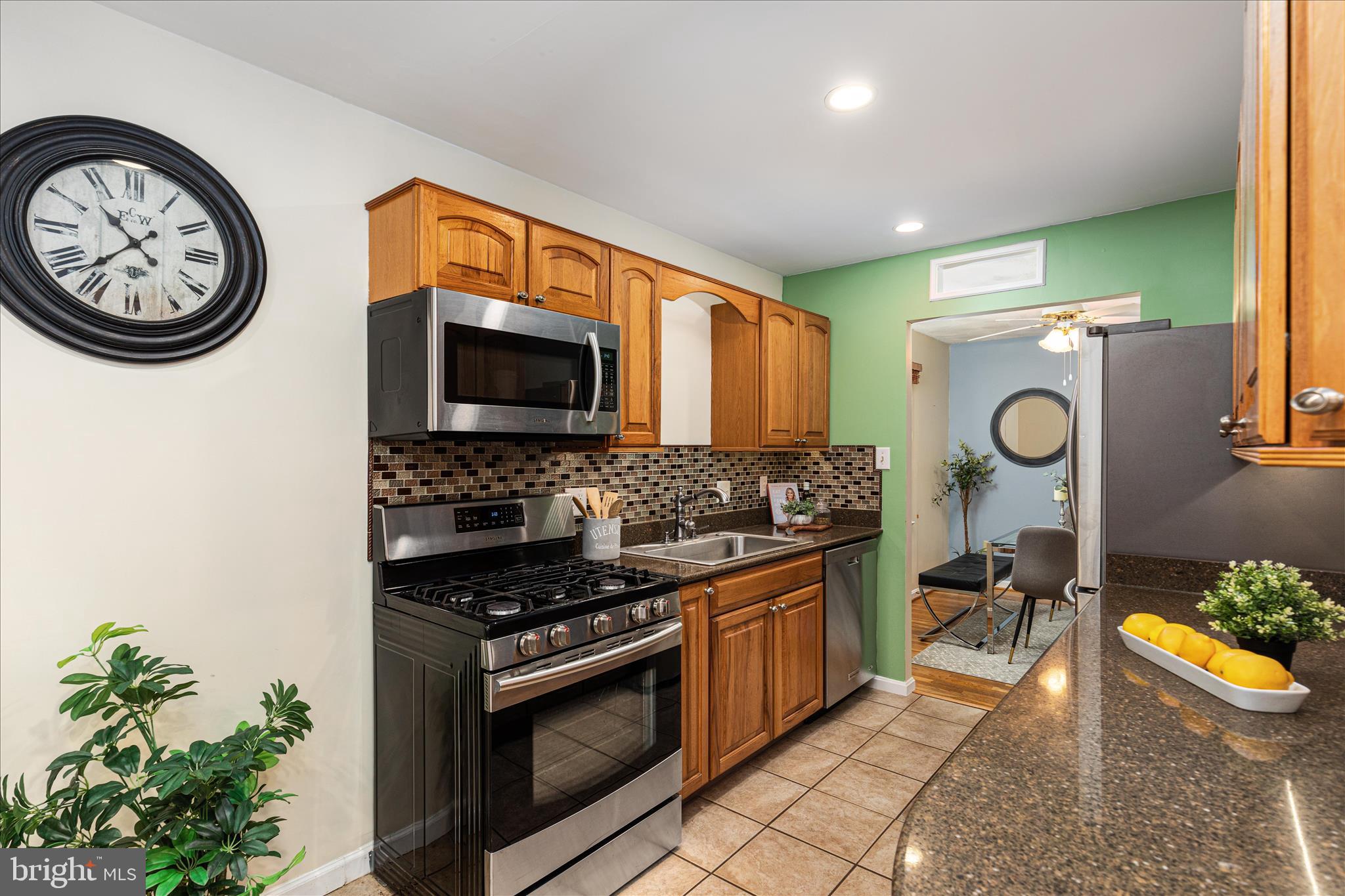 7398 Roxbury Avenue Manassas, VA 20109 - Photo 6 of 75 a kitchen with stainless steel appliances a stove a microwave a sink and a stove
