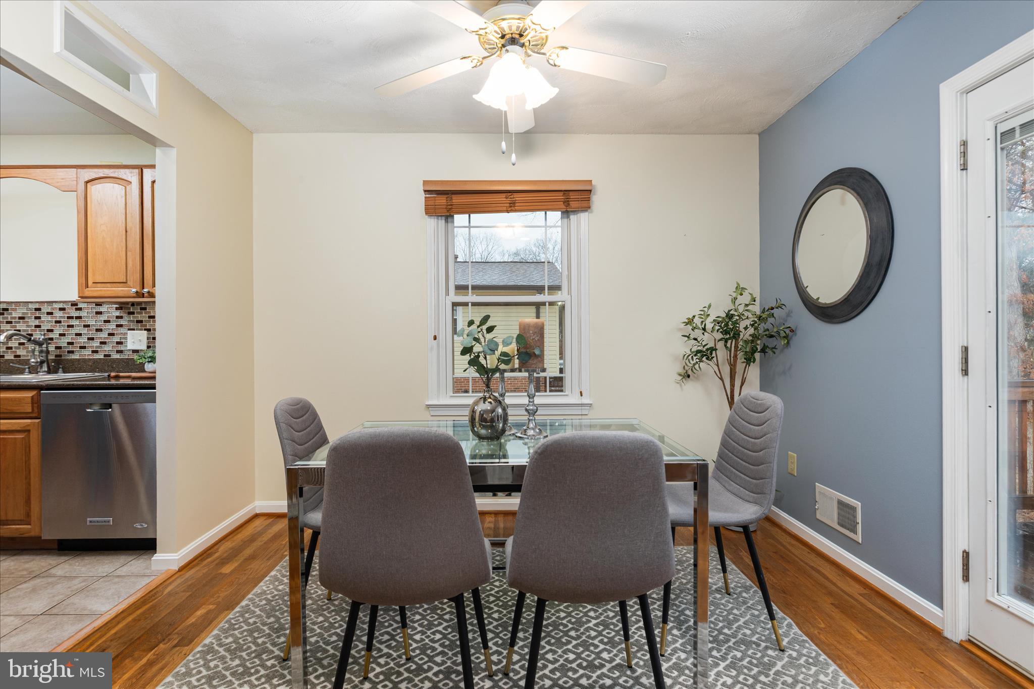 7398 Roxbury Avenue Manassas, VA 20109 - Photo 10 of 75 a view of a dining room with furniture window and wooden floor