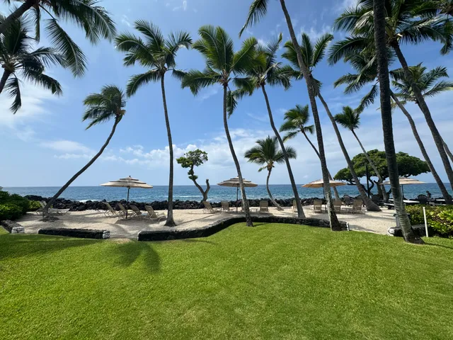 a view of a swimming pool with a table and chairs