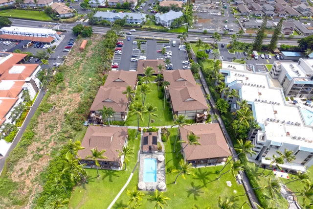 an aerial view of residential houses with outdoor space