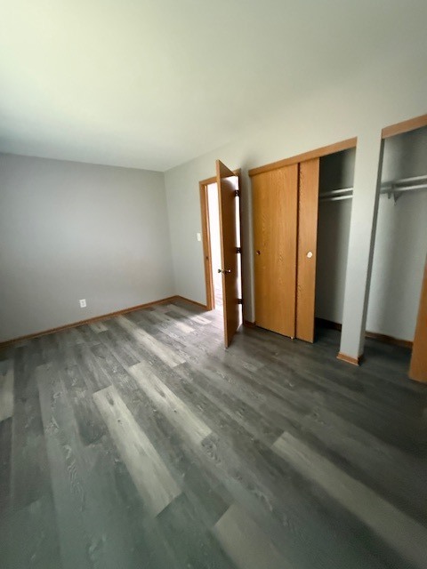 1351 Monomoy Street, Unit D Aurora, IL 60506 - Photo 11 of 14 a view of an empty room with wooden floor and a window
