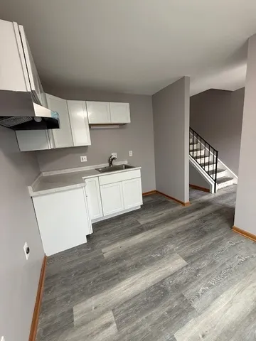 a view of a kitchen with electric appliances