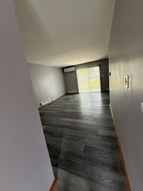 1351 Monomoy Street, Unit D Aurora, IL 60506 - Photo 7 of 14 a view of a hallway with wooden floor and stairs