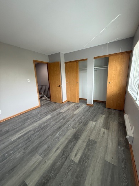 1351 Monomoy Street, Unit D Aurora, IL 60506 - Photo 10 of 14 a view of empty room with wooden floor and fan