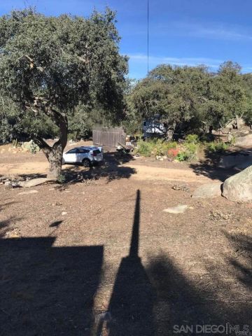 a view of swimming pool with a yard