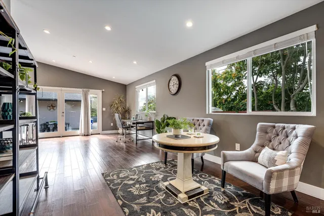 a living room with furniture and a potted plant