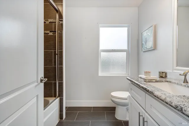 a backyard of a house with outdoor seating