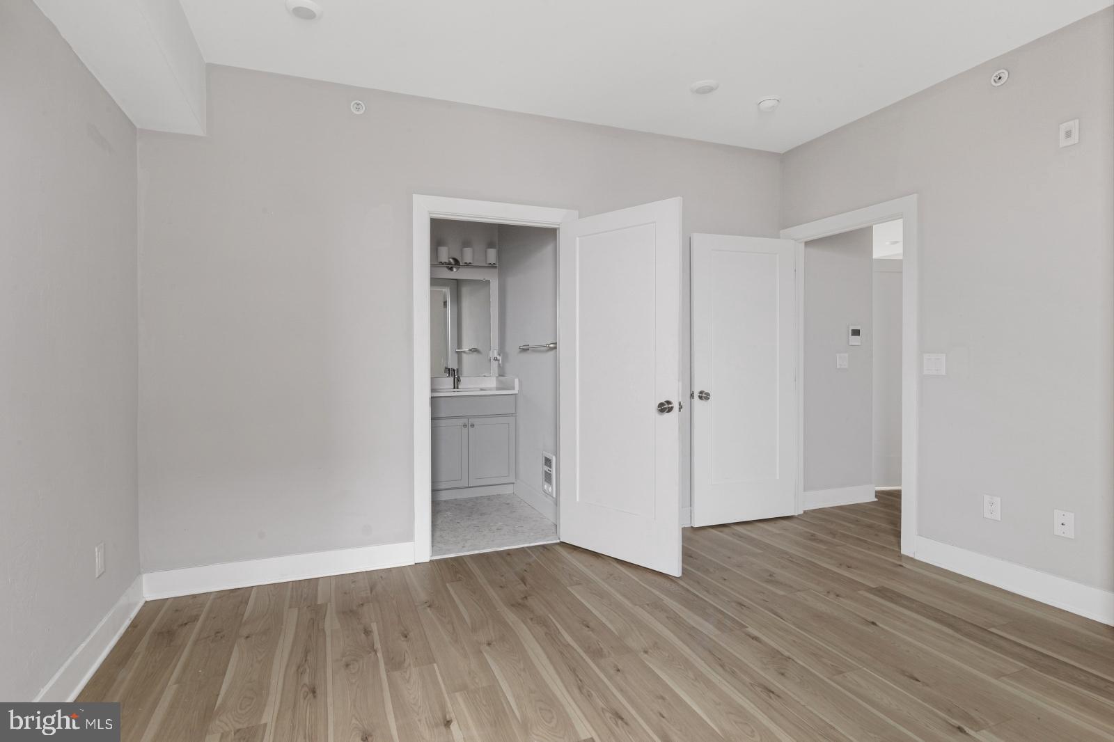 5230 Walnut Street, Unit 4R Philadelphia, PA 19139 - Photo 14 of 19 a view of wooden floor in an empty room