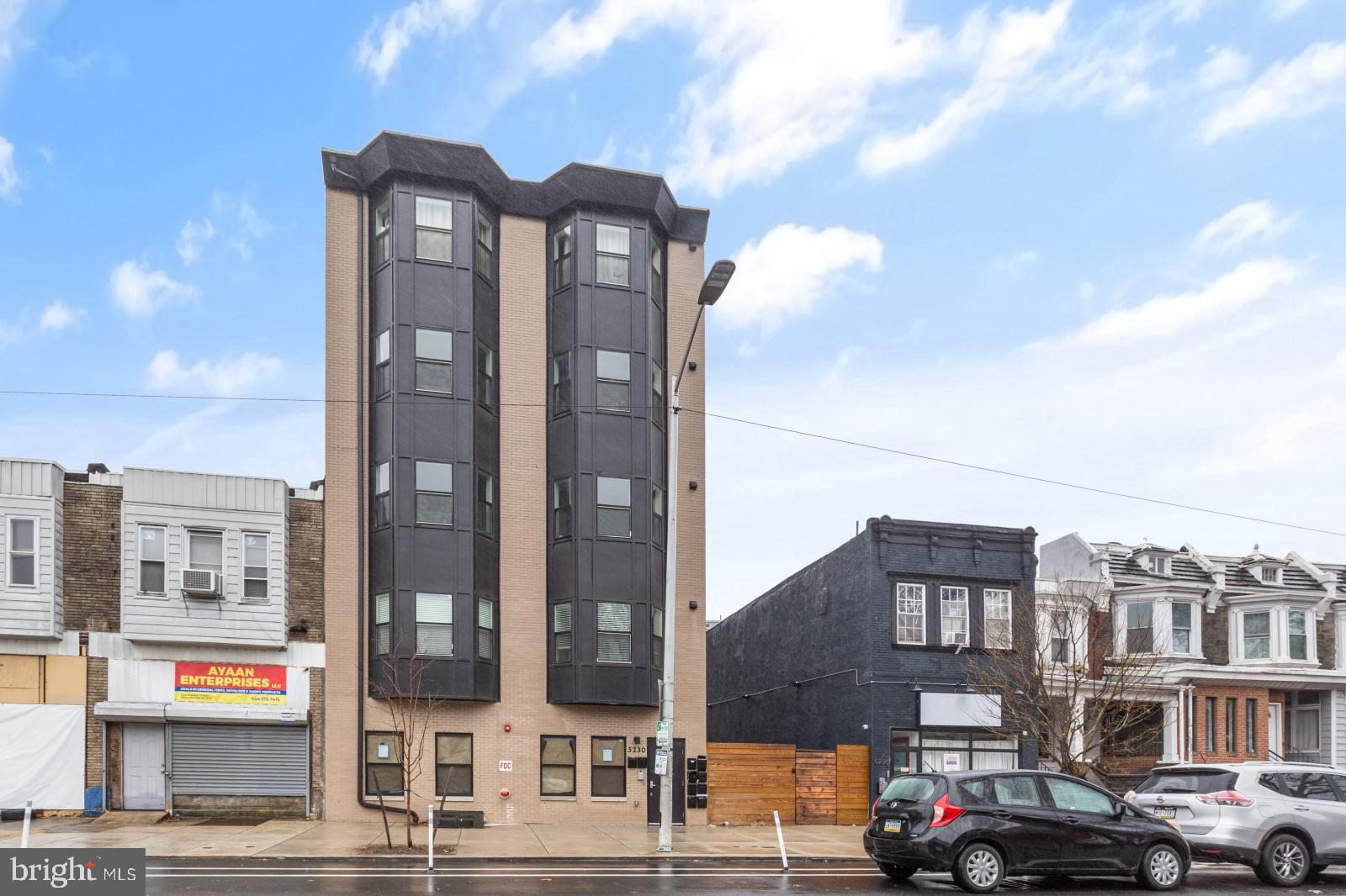 5230 Walnut Street, Unit 4R Philadelphia, PA 19139 - Photo 19 of 19 a front view of a building with street view