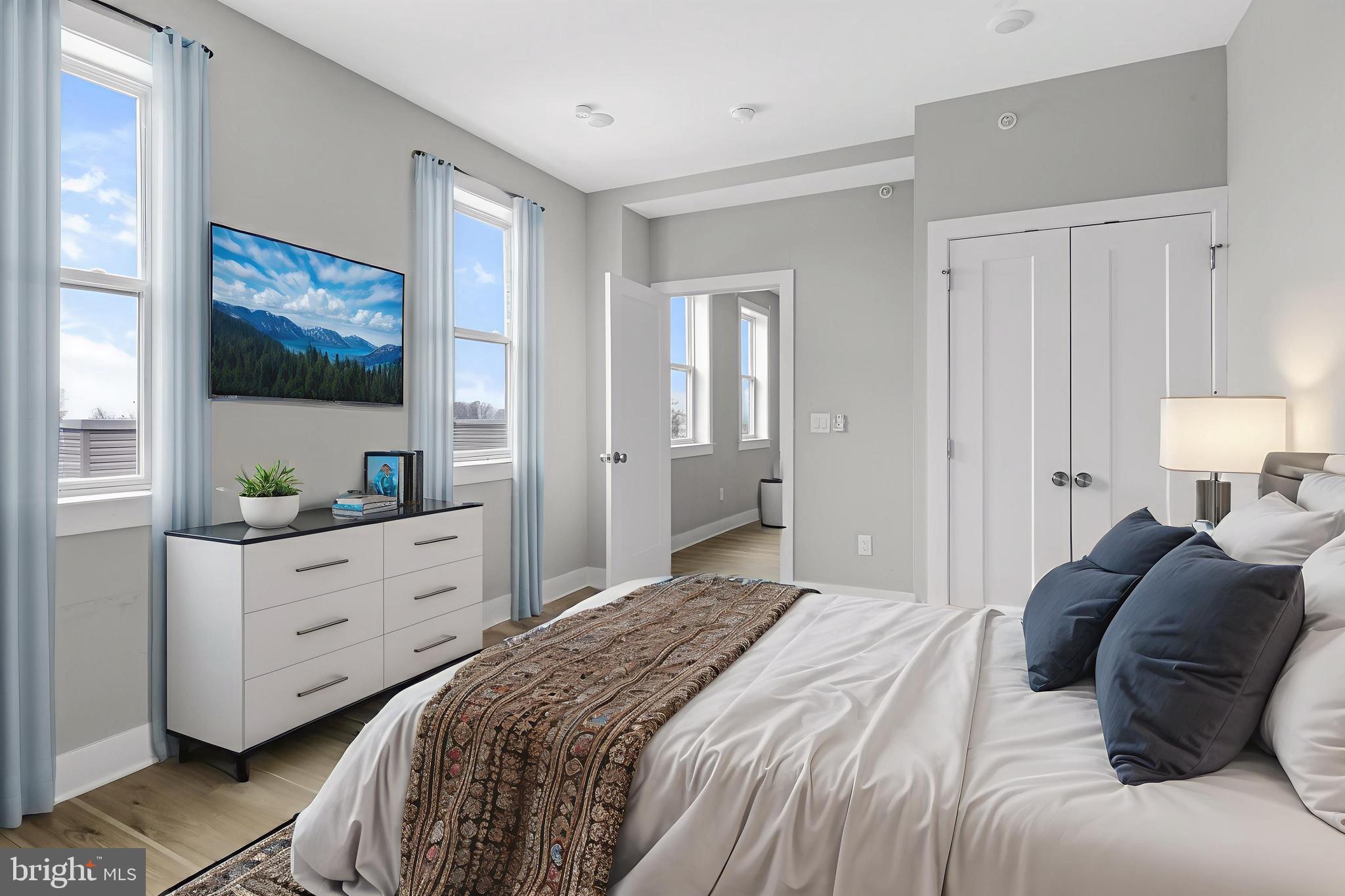 5230 Walnut Street, Unit 4R Philadelphia, PA 19139 - Photo 2 of 19 a bedroom with a bed and a window