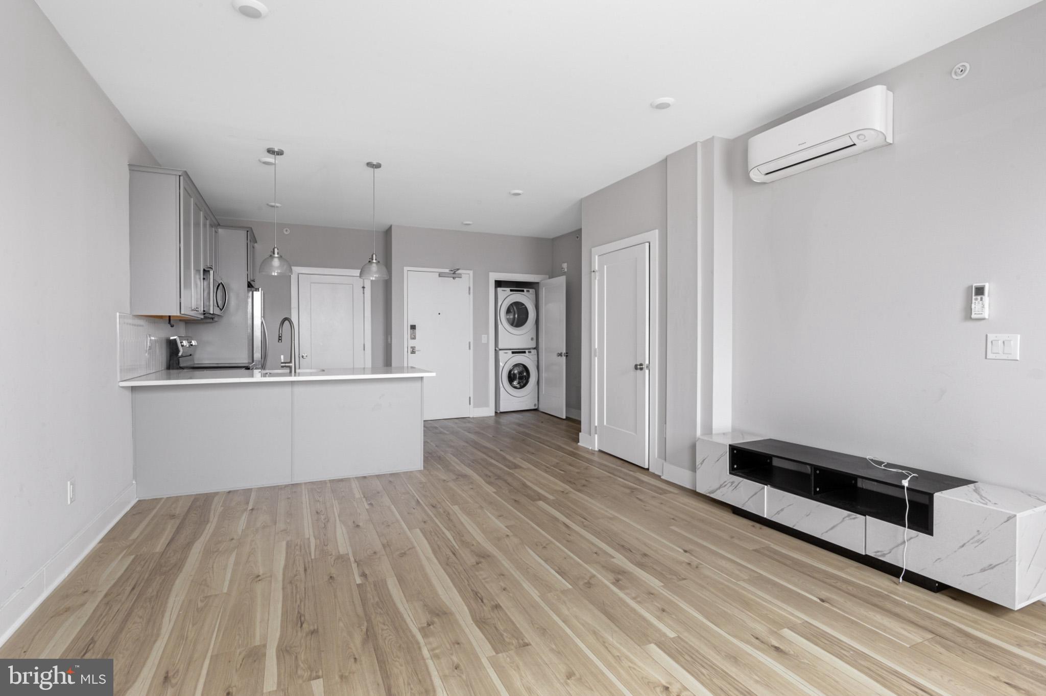 5230 Walnut Street, Unit 4R Philadelphia, PA 19139 - Photo 6 of 19 a view of a kitchen with wooden floor