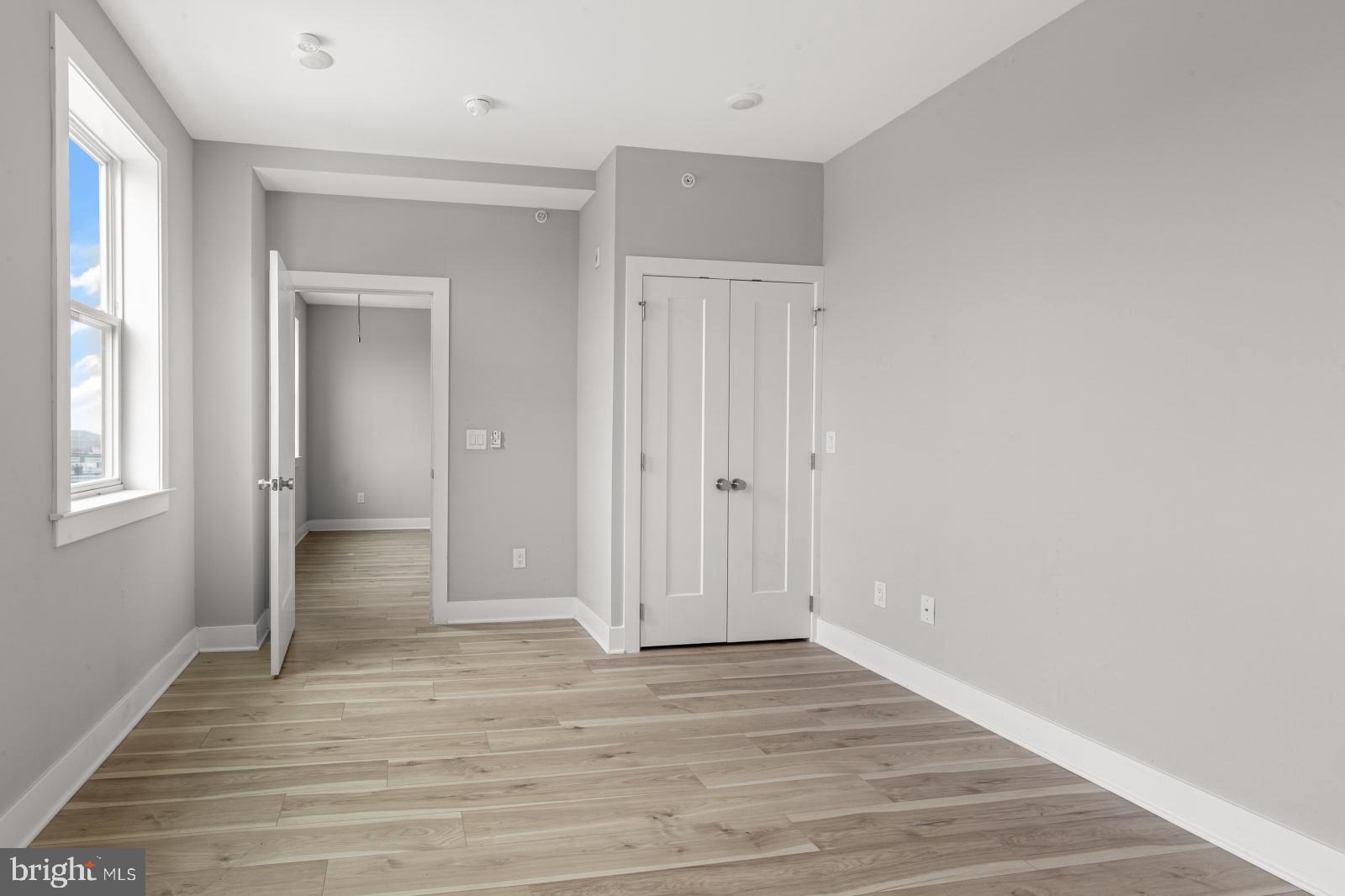 5230 Walnut Street, Unit 4R Philadelphia, PA 19139 - Photo 9 of 19 a view of an empty room with wooden floor