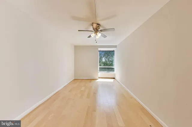 a view of an empty room with a bathroom