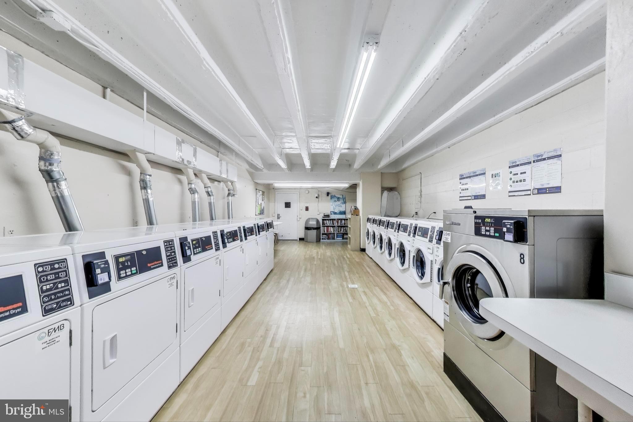 1435 4th Street Southwest, Unit B609 Washington, DC 20024 - Photo 19 of 28 a view of a hallway with washer and dryer