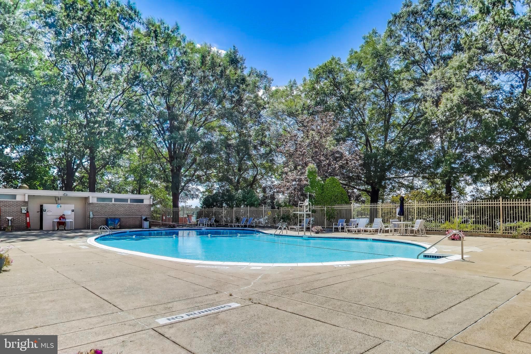 1435 4th Street Southwest, Unit B609 Washington, DC 20024 - Photo 23 of 28 a view of swimming pool with trees in the background