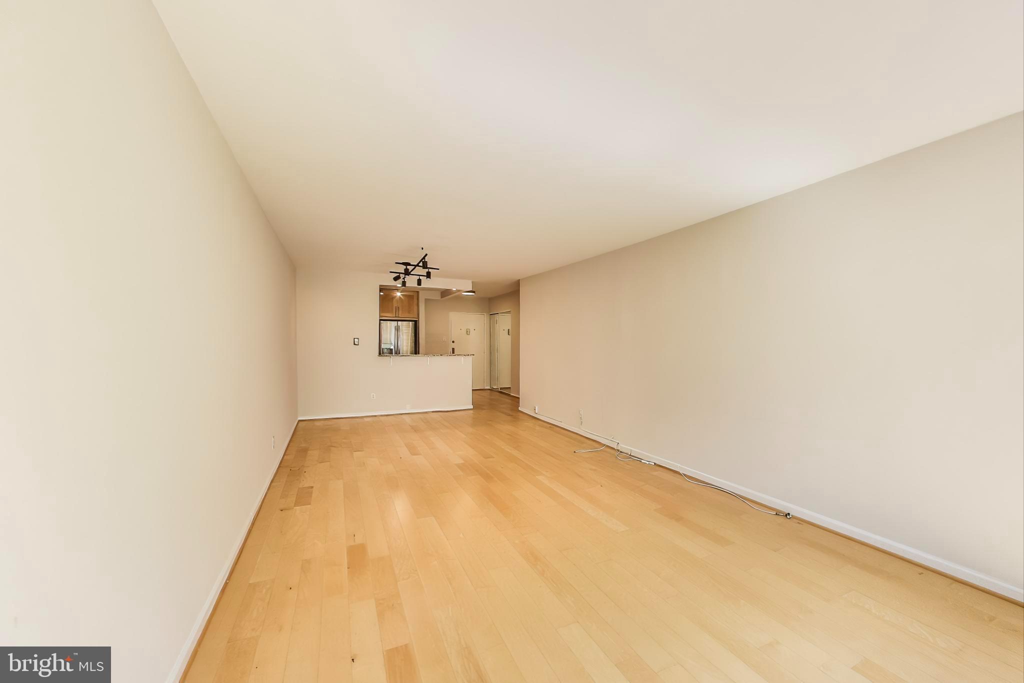 1435 4th Street Southwest, Unit B609 Washington, DC 20024 - Photo 9 of 28 a view of a big room with closet and windows