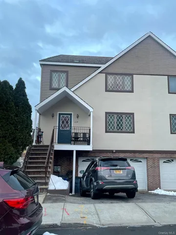 a car parked in front of a house