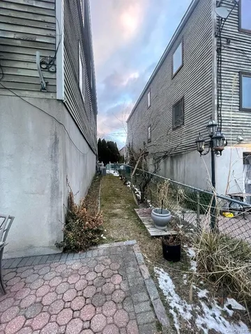 a backyard of a house with outdoor seating