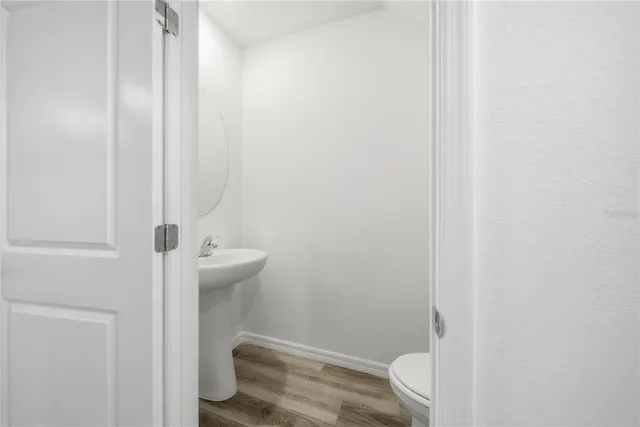 a bathroom with a sink and toilet