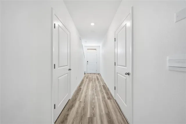 a view of a hallway with stairs