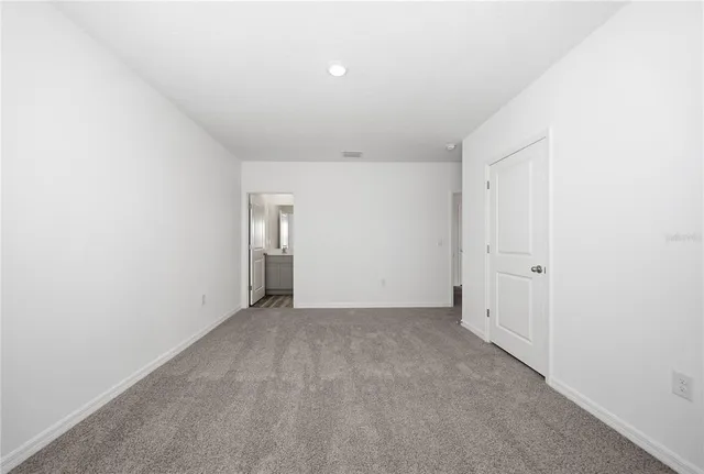a bathroom with a double vanity sink toilet and shower