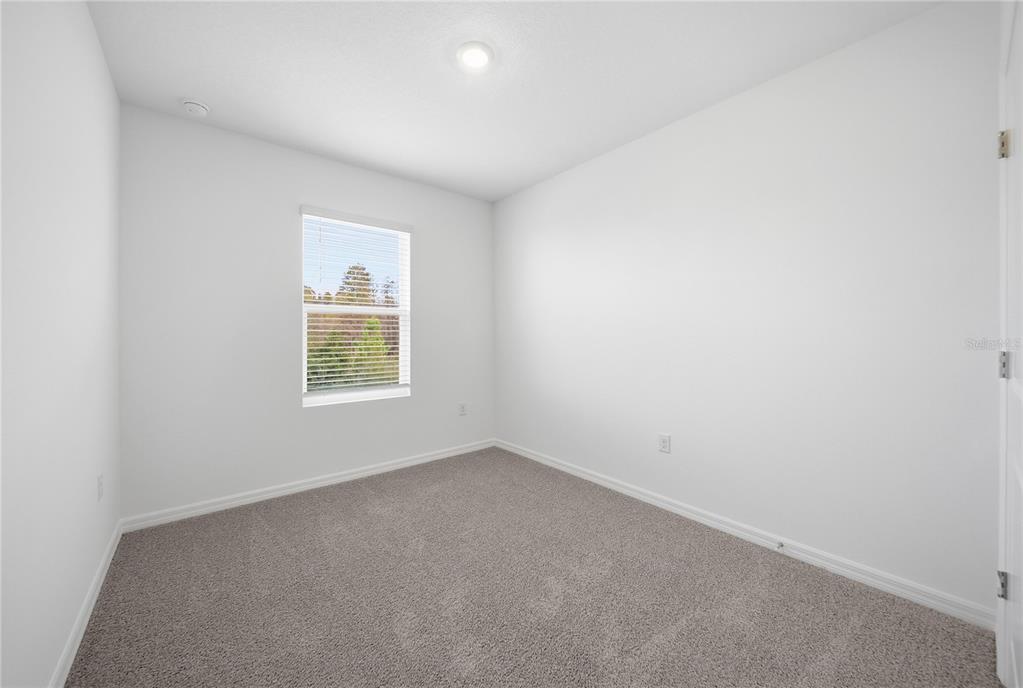 32497 Midsummer Night Lane Wesley Chapel, FL 33543 - Photo 18 of 30 an empty room with a window