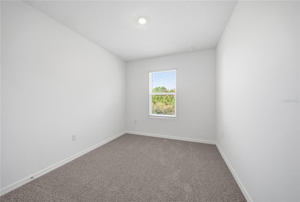 32497 Midsummer Night Lane Wesley Chapel, FL 33543 - Photo 20 of 30 an empty room with a window