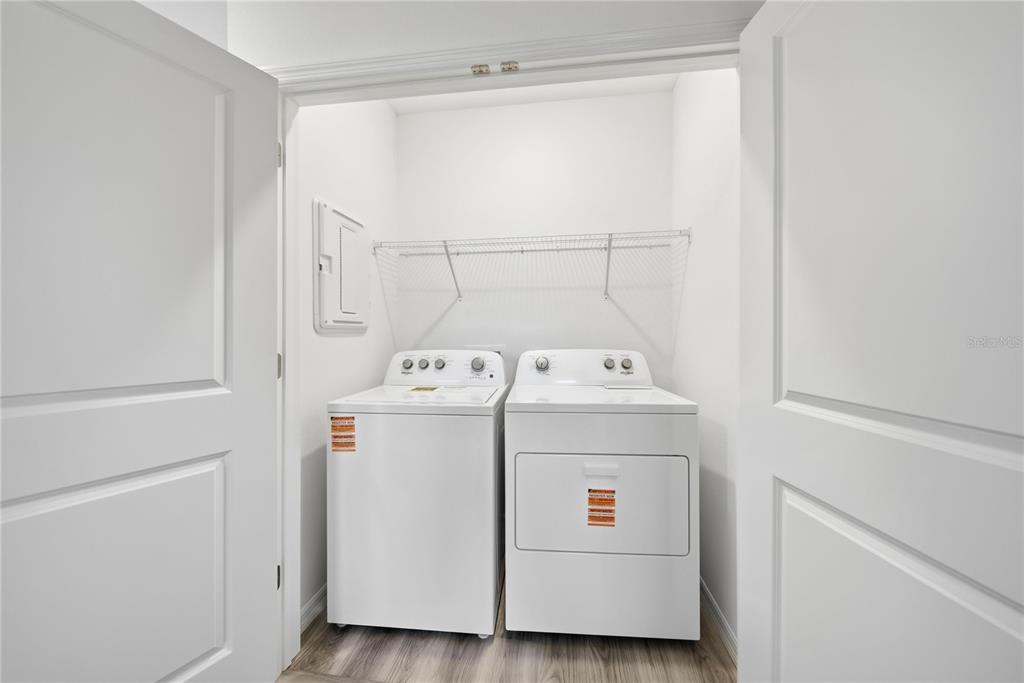 32497 Midsummer Night Lane Wesley Chapel, FL 33543 - Photo 23 of 30 a utility room with dryer and washer