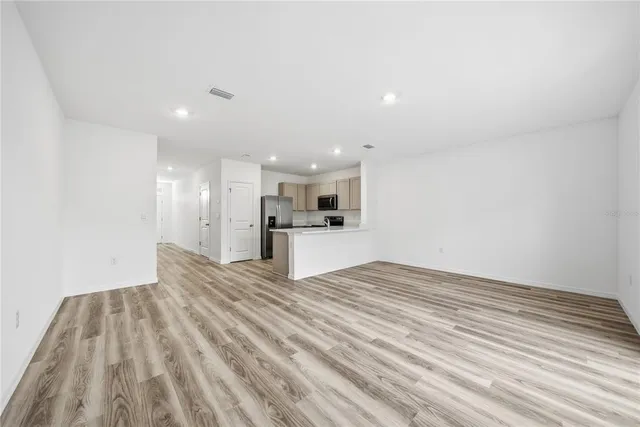 a view of kitchen cabinet and microwave