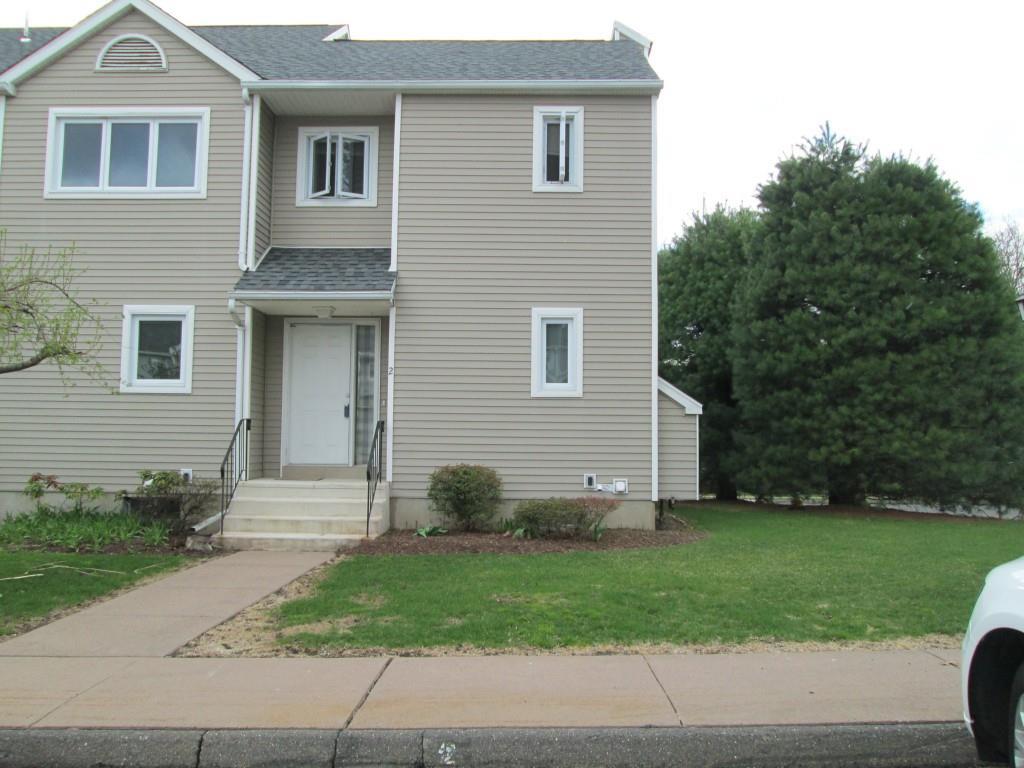 2 Oak Ridge Drive, Unit 2 Windsor Locks, CT 06096 - Photo 1 of 1 a front view of house with yard and green space