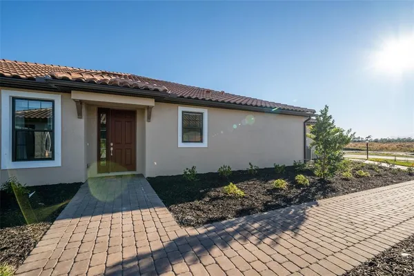 a view of a lake with houses in the background