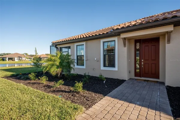 a view of a lake with houses in the background