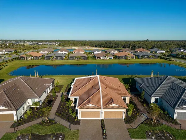 an aerial view of a house with a ocean view