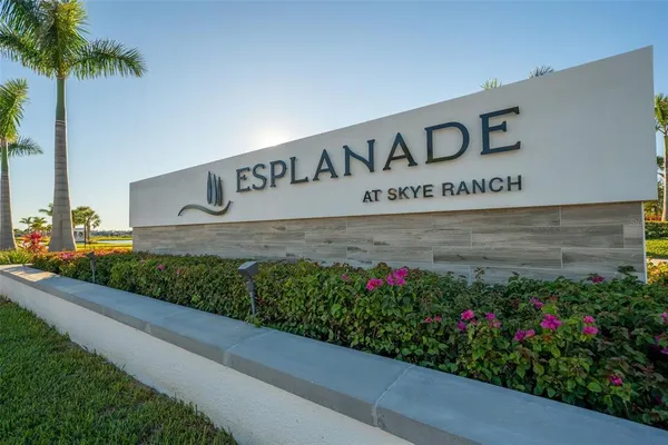 a kitchen with a sink window and cabinets
