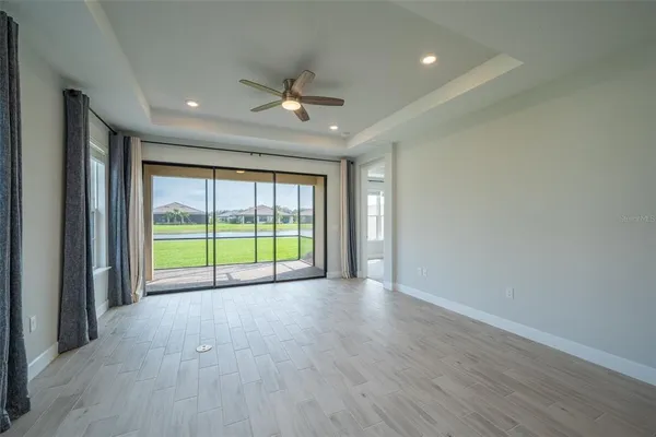 a kitchen with stainless steel appliances granite countertop a sink a refrigerator and a sink