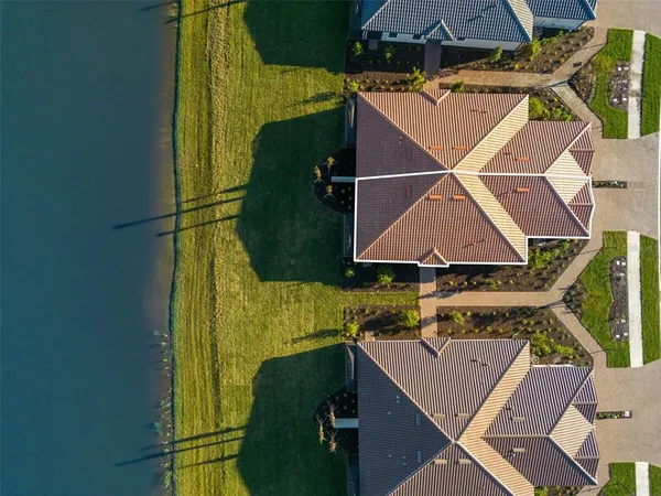 an aerial view of residential building and ocean
