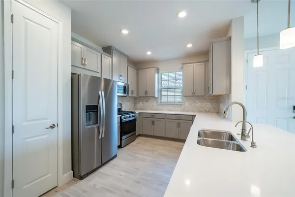 a bathroom with a sink vanity and a mirror