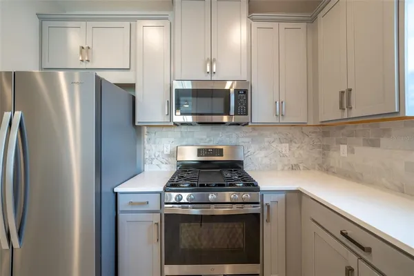 a bathroom with a double vanity sink and mirror