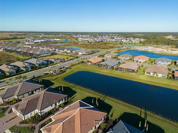 an aerial view of residential building and ocean