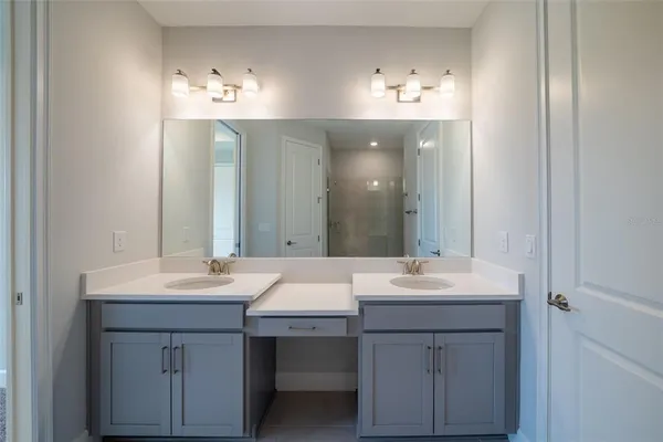 a view of a porch with chairs and floor to ceiling window