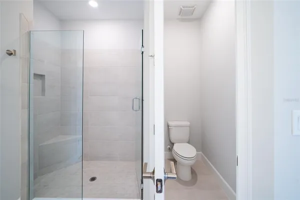 a view of city from balcony with seating space