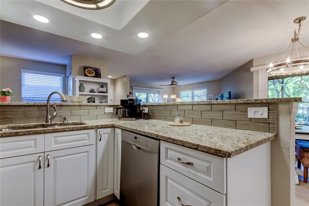 1407 Lennox Road East, Unit 1407 Palm Harbor, FL 34683 - Photo 17 of 48 a kitchen with a sink and cabinets