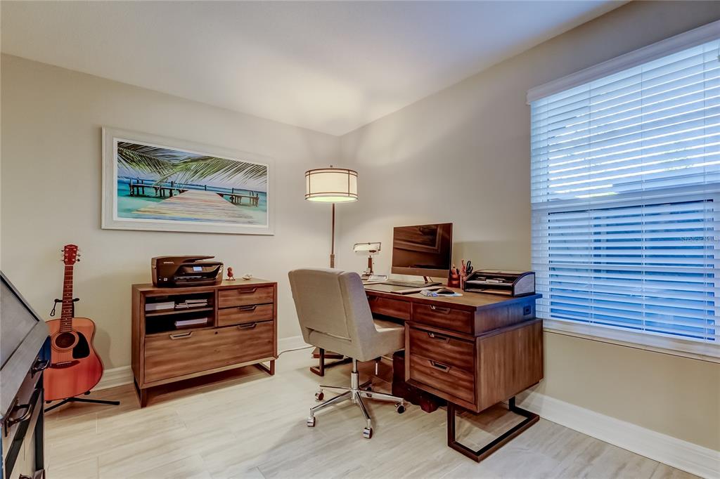 1407 Lennox Road East, Unit 1407 Palm Harbor, FL 34683 - Photo 20 of 48 a view of a workspace with furniture and a window