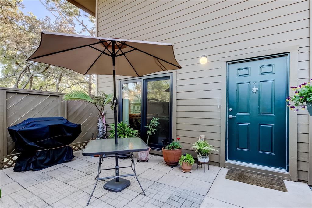 1407 Lennox Road East, Unit 1407 Palm Harbor, FL 34683 - Photo 2 of 48 a view of a backyard with furniture and patio