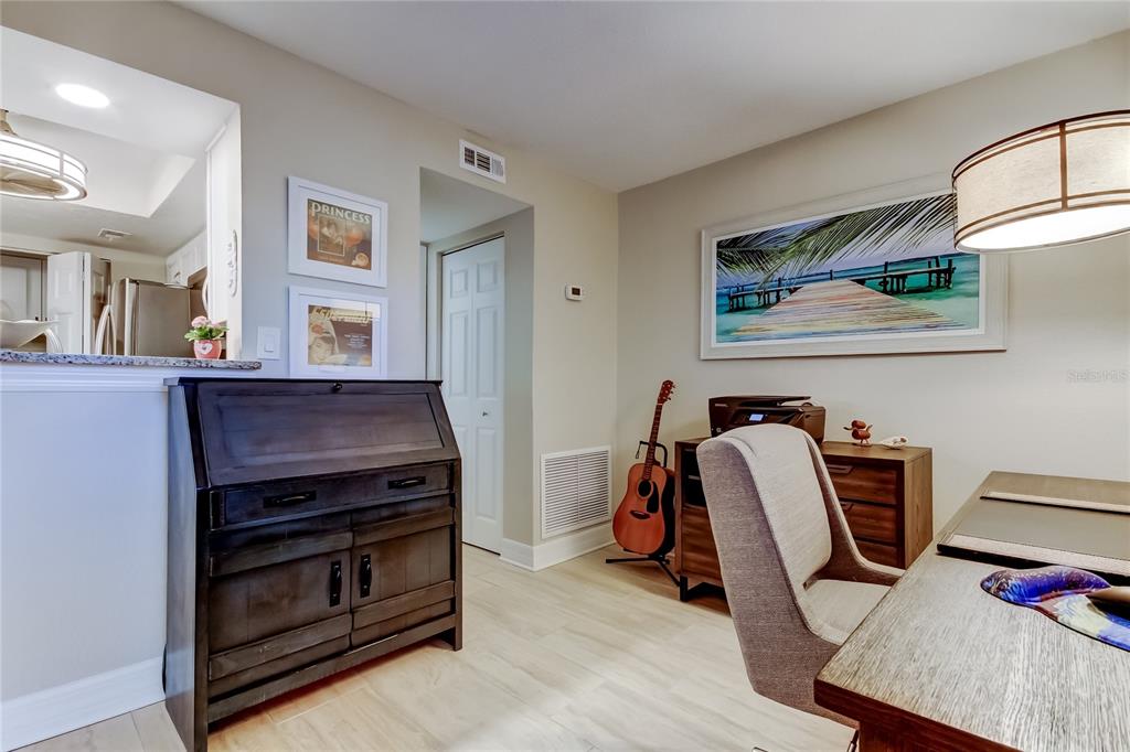 1407 Lennox Road East, Unit 1407 Palm Harbor, FL 34683 - Photo 21 of 48 a view of a workspace with furniture and a window