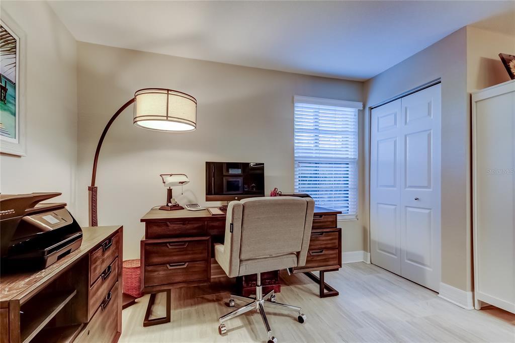1407 Lennox Road East, Unit 1407 Palm Harbor, FL 34683 - Photo 22 of 48 a workspace with furniture and a potted plant