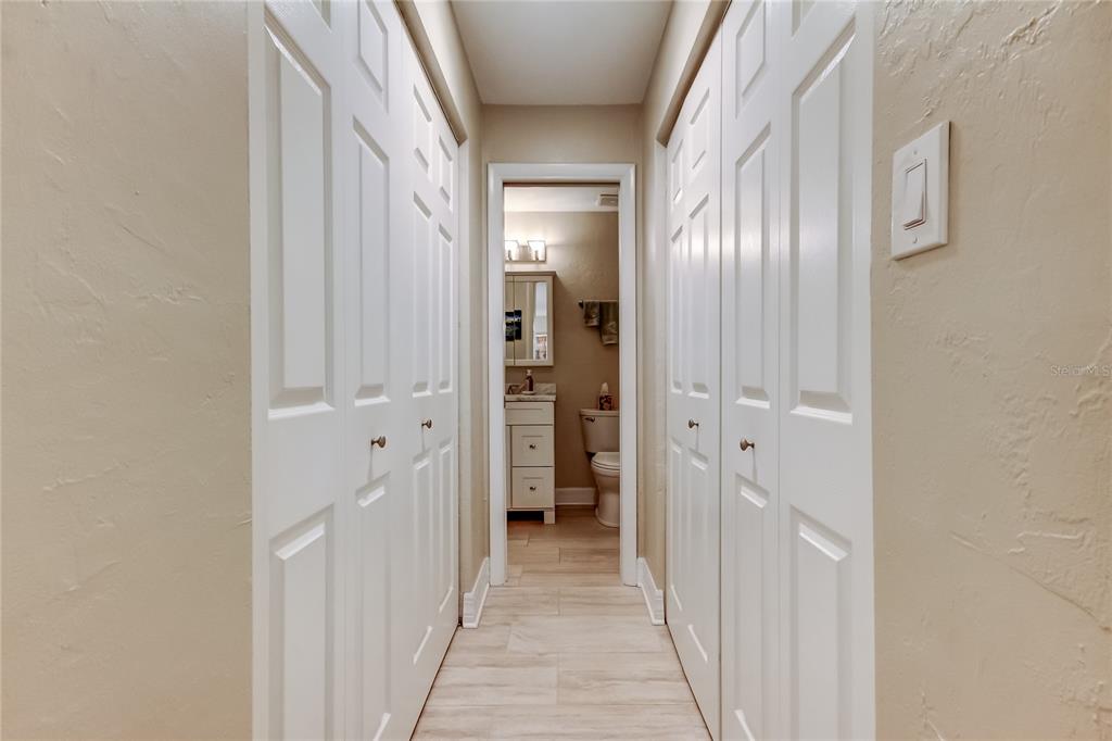 1407 Lennox Road East, Unit 1407 Palm Harbor, FL 34683 - Photo 26 of 48 a view of a hallway with wooden shelves