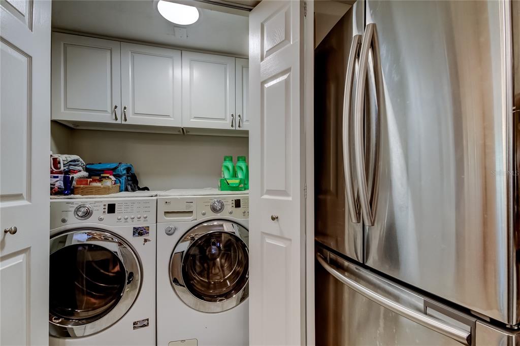 1407 Lennox Road East, Unit 1407 Palm Harbor, FL 34683 - Photo 34 of 48 a view of hallway with washer and dryer